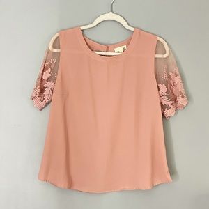 Soft pink blouse with lace sleeves